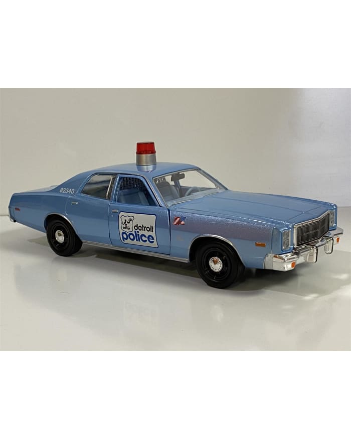 a blue toy car with a light on top