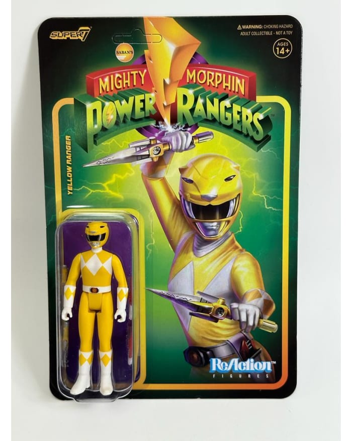 a yellow action figure in a package