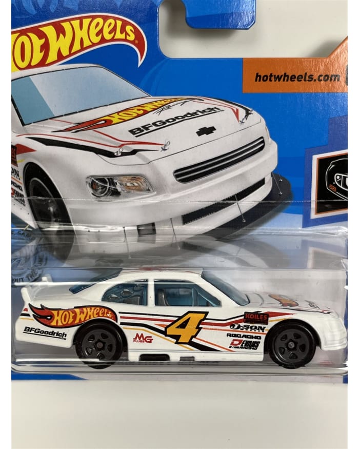 a white toy car in a package