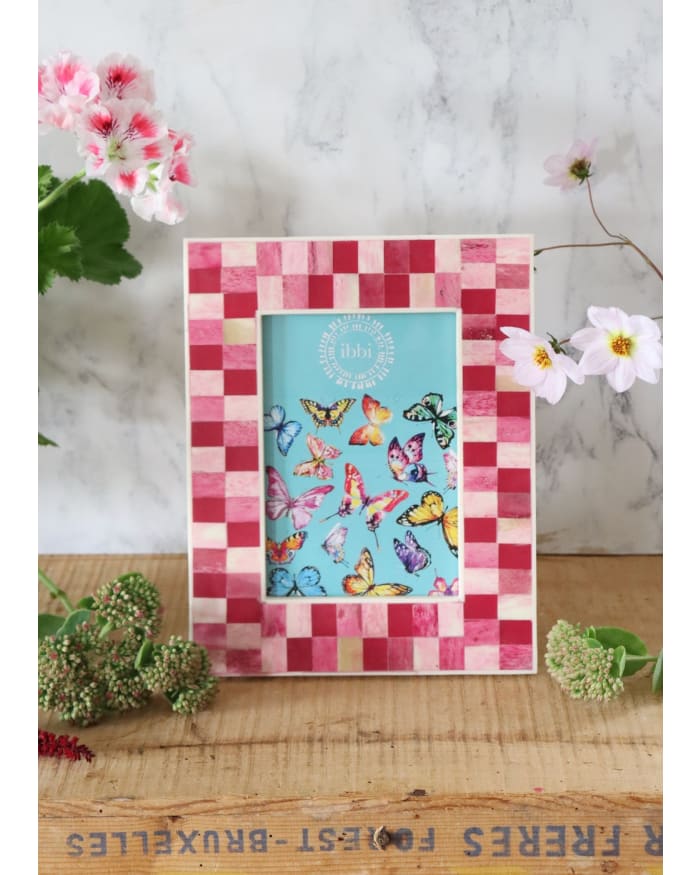 a picture frame with butterflies on it