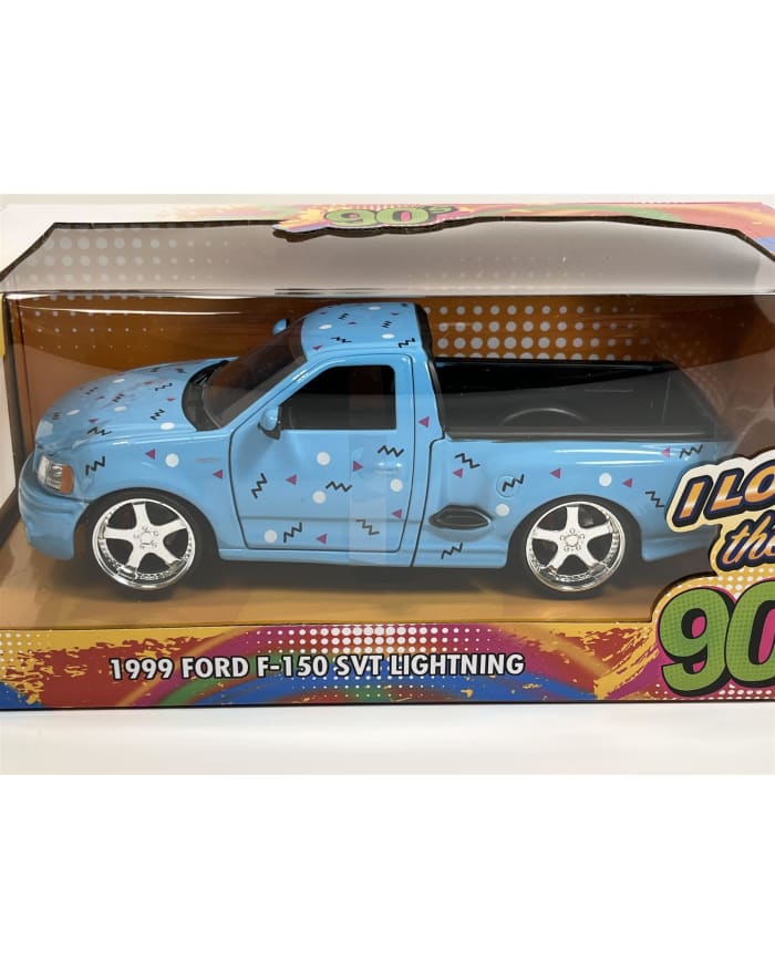 a blue toy truck in a box