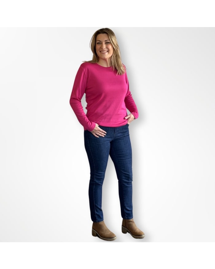 a woman in pink shirt and jeans