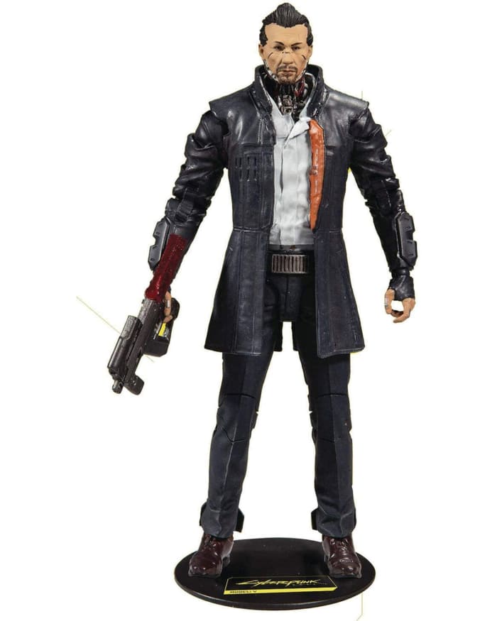 a toy figure of a man holding a gun