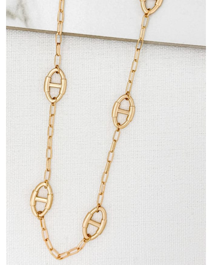 a gold chain with ovals on it