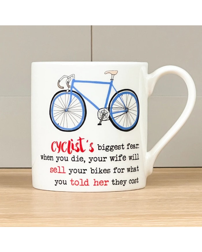 a white mug with a blue bicycle on it