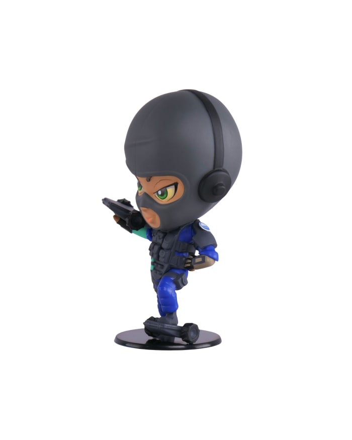 a toy figurine of a person wearing a helmet and holding a gun