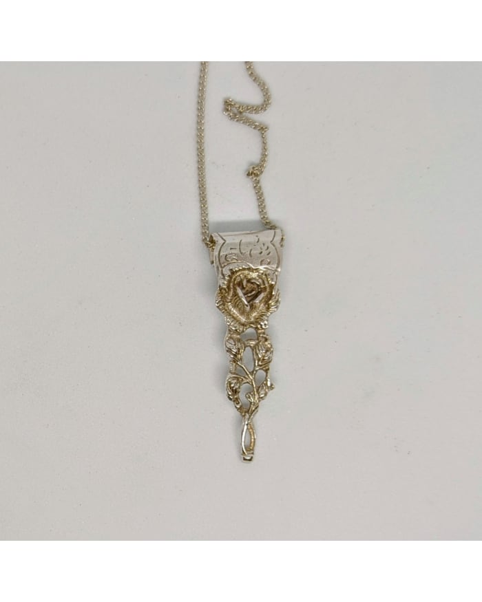 a necklace with a flower on it