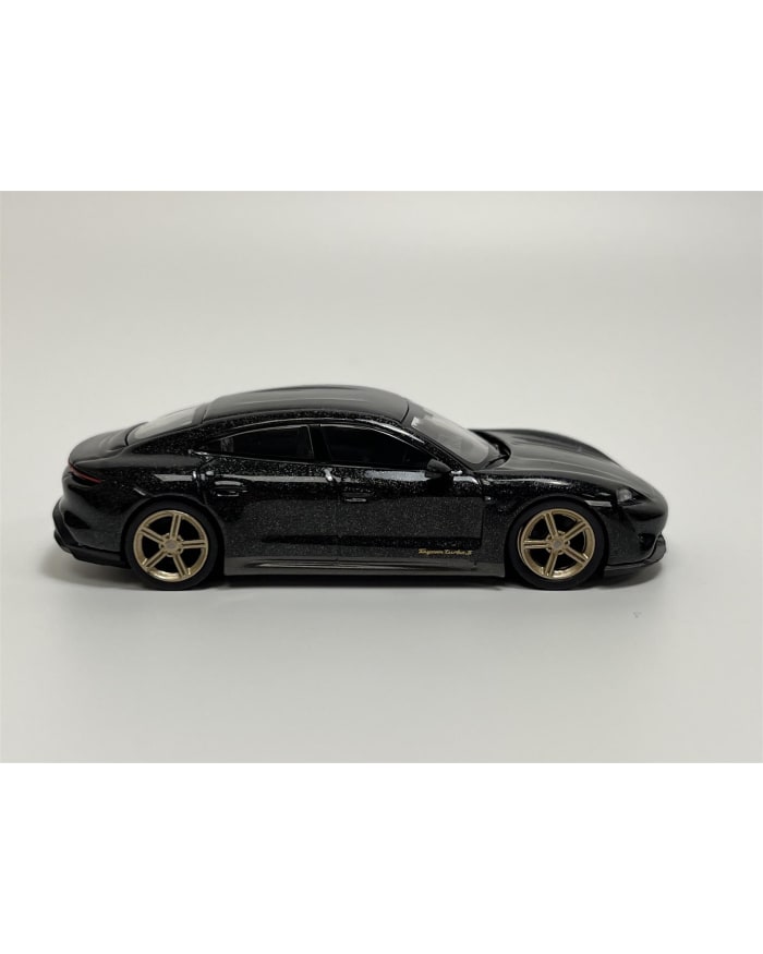 a black toy car with gold rims