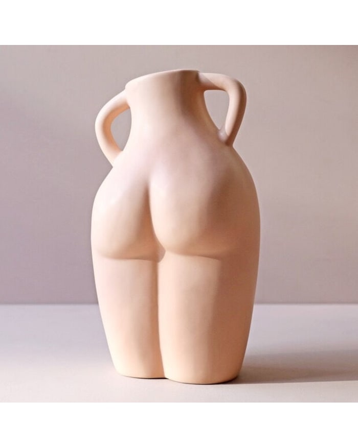 a white vase with two handles