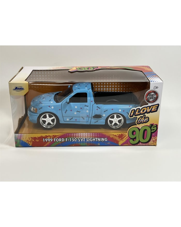 a blue toy truck in a box