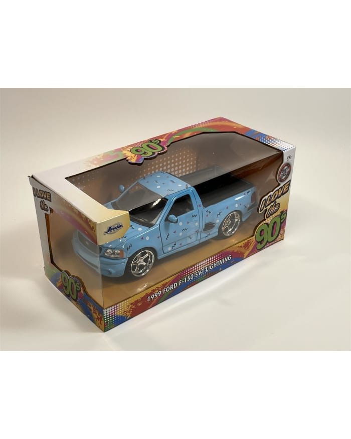 a blue toy truck in a box