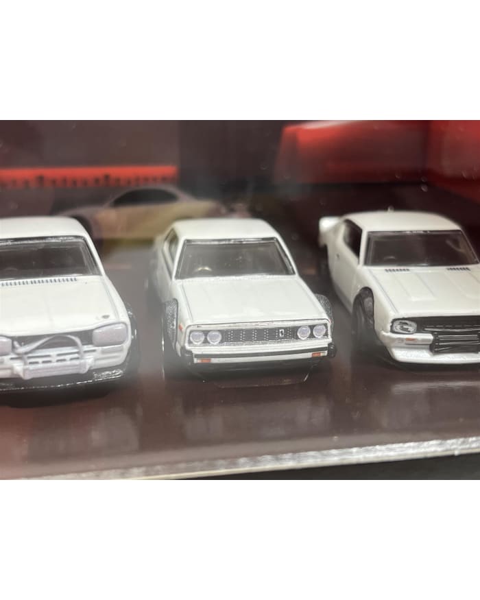 a group of white toy cars