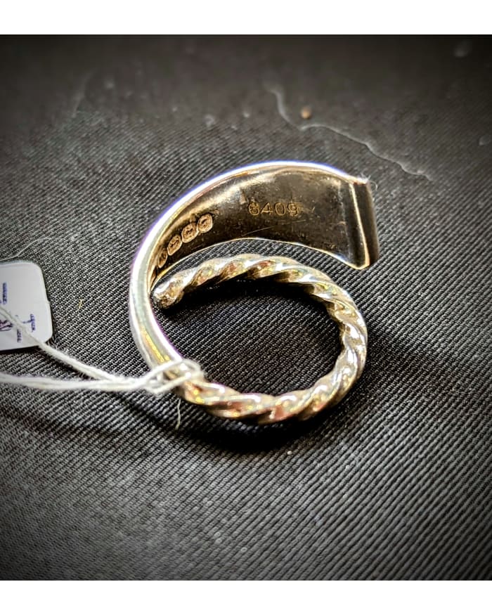 a ring with a tag on it
