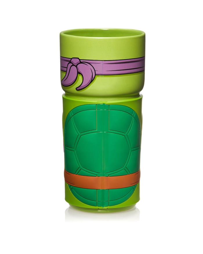 a green cup with a turtle design