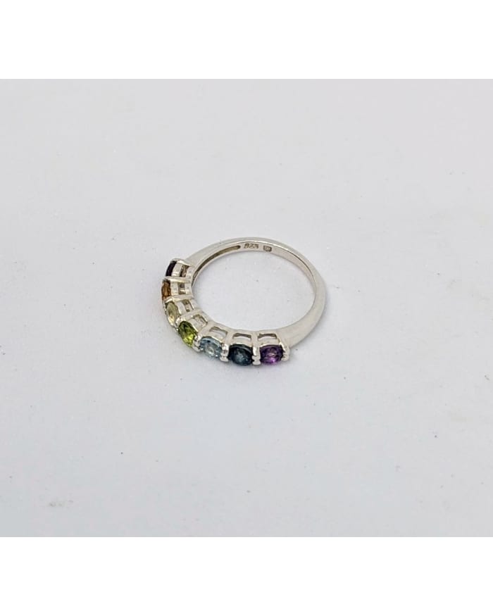 a ring with multicolored gemstones