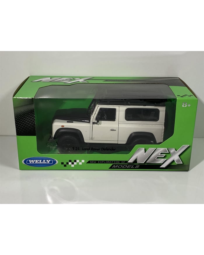 a white toy car in a green box