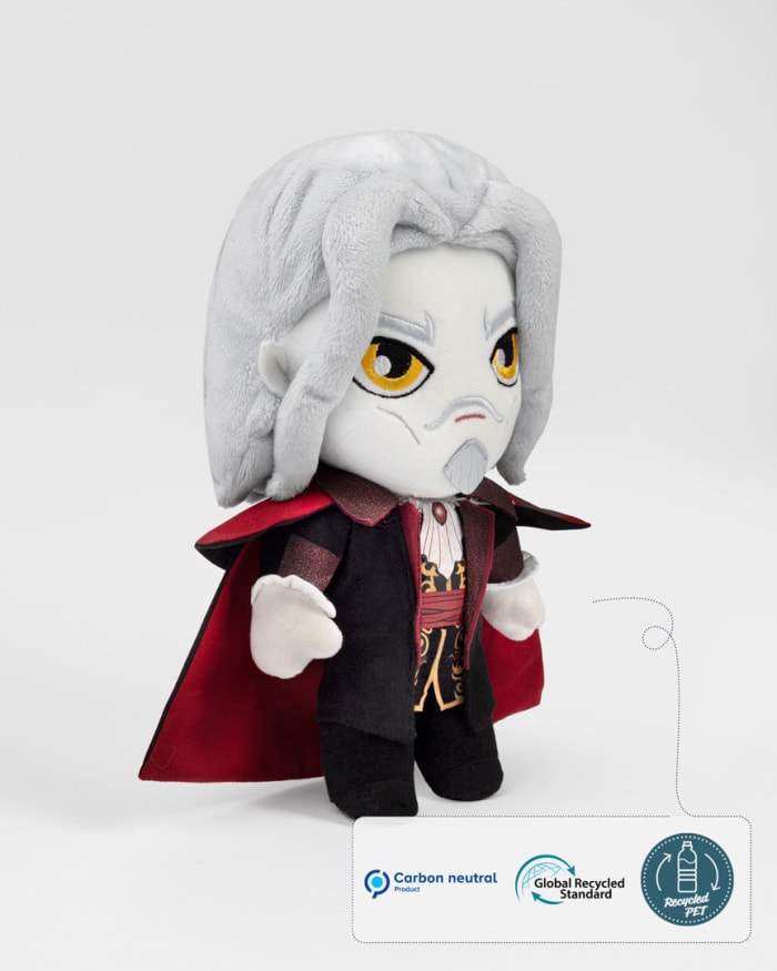 a stuffed toy with a white hair and a red cape