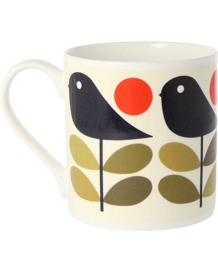 a white mug with birds on it