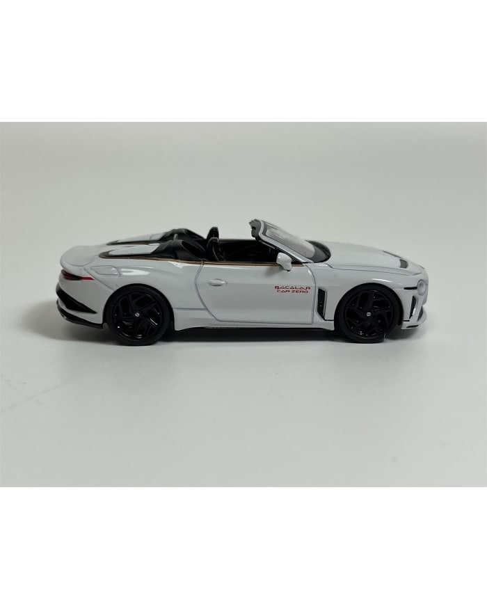 a white toy car with black wheels