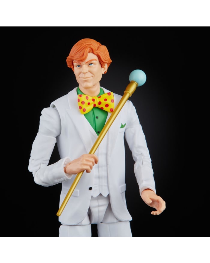 a toy figurine of a man in a white suit