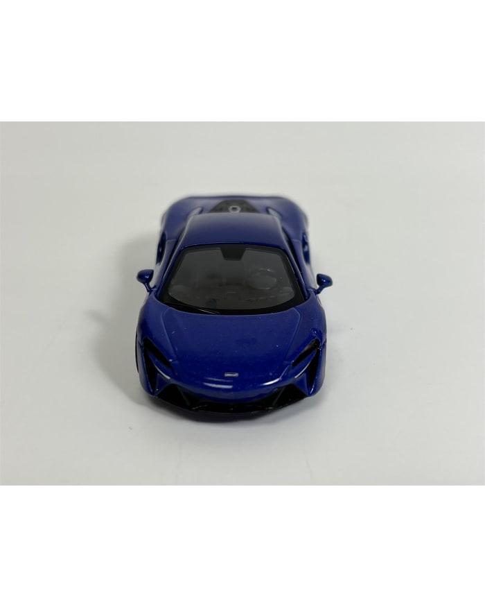 a blue toy car on a white surface