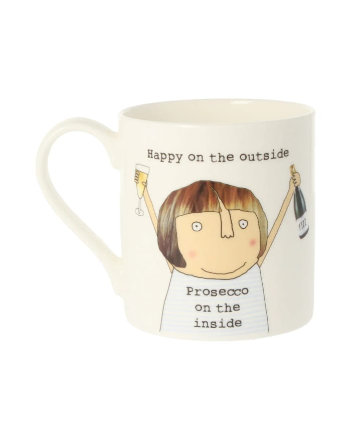 a white mug with a cartoon character on it