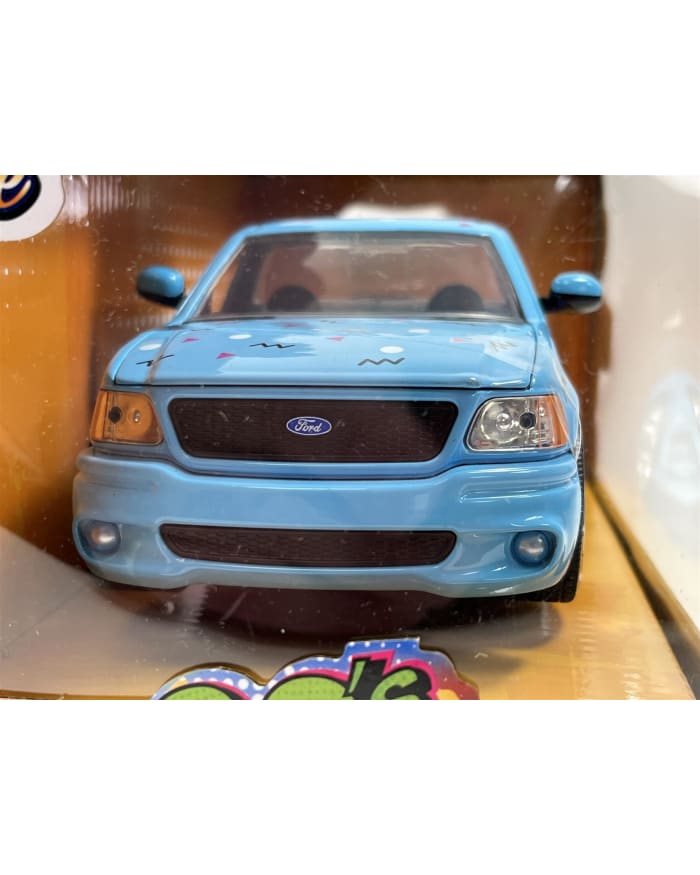 a blue toy car in a box