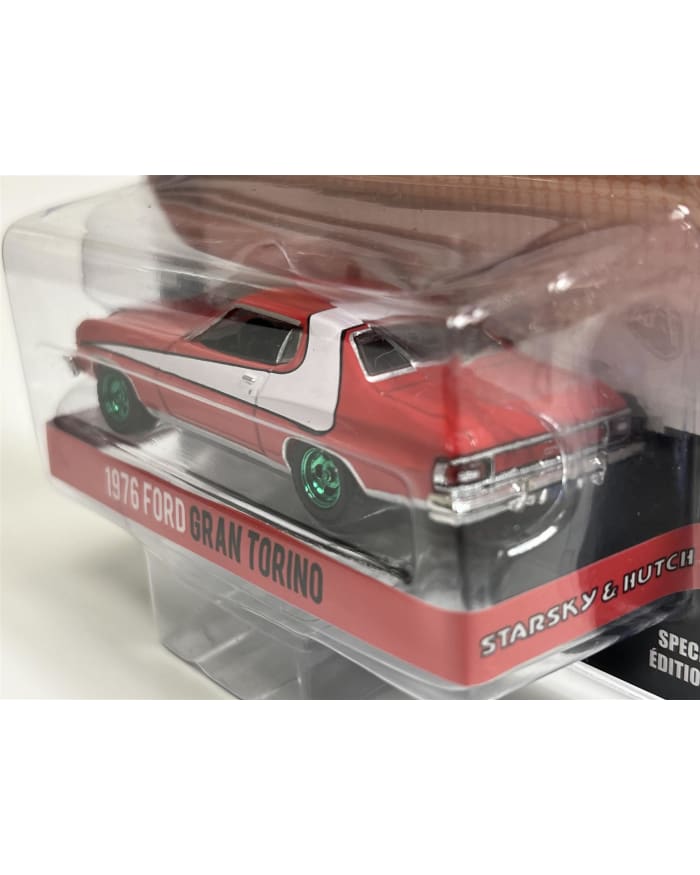 a red toy car in a plastic box