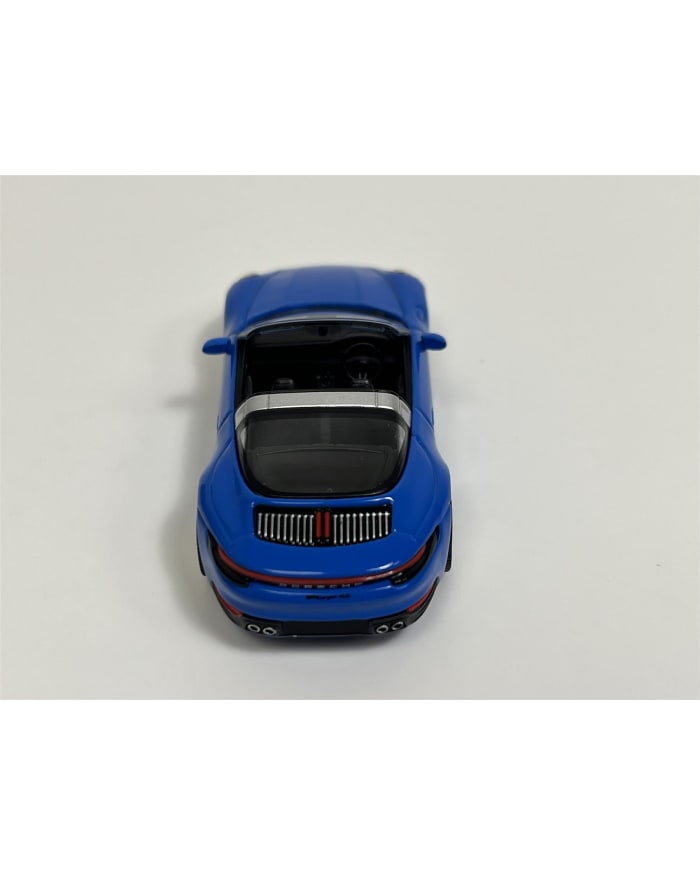 a blue toy car on a white background