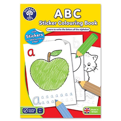 a book with a green apple and pencils