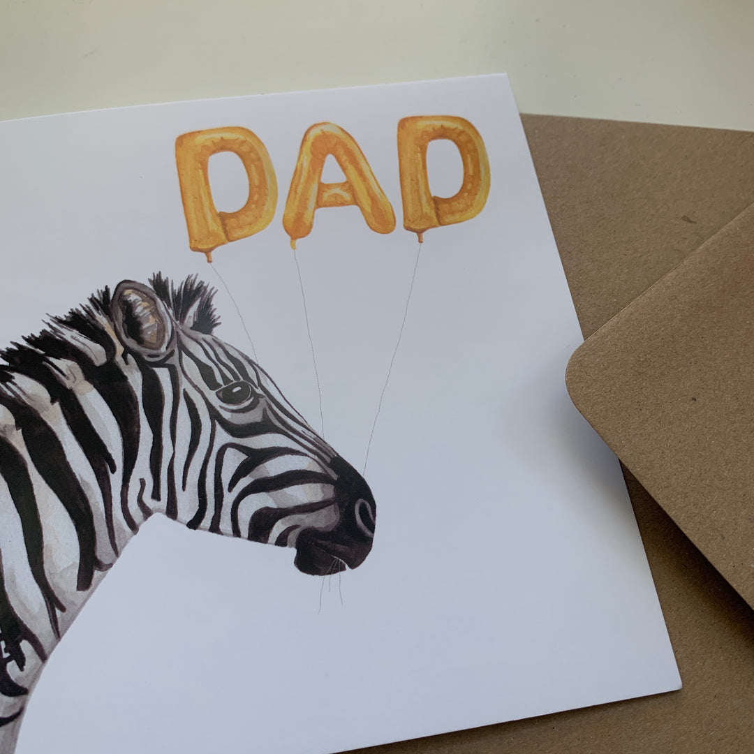 a card with a zebra and balloons on it