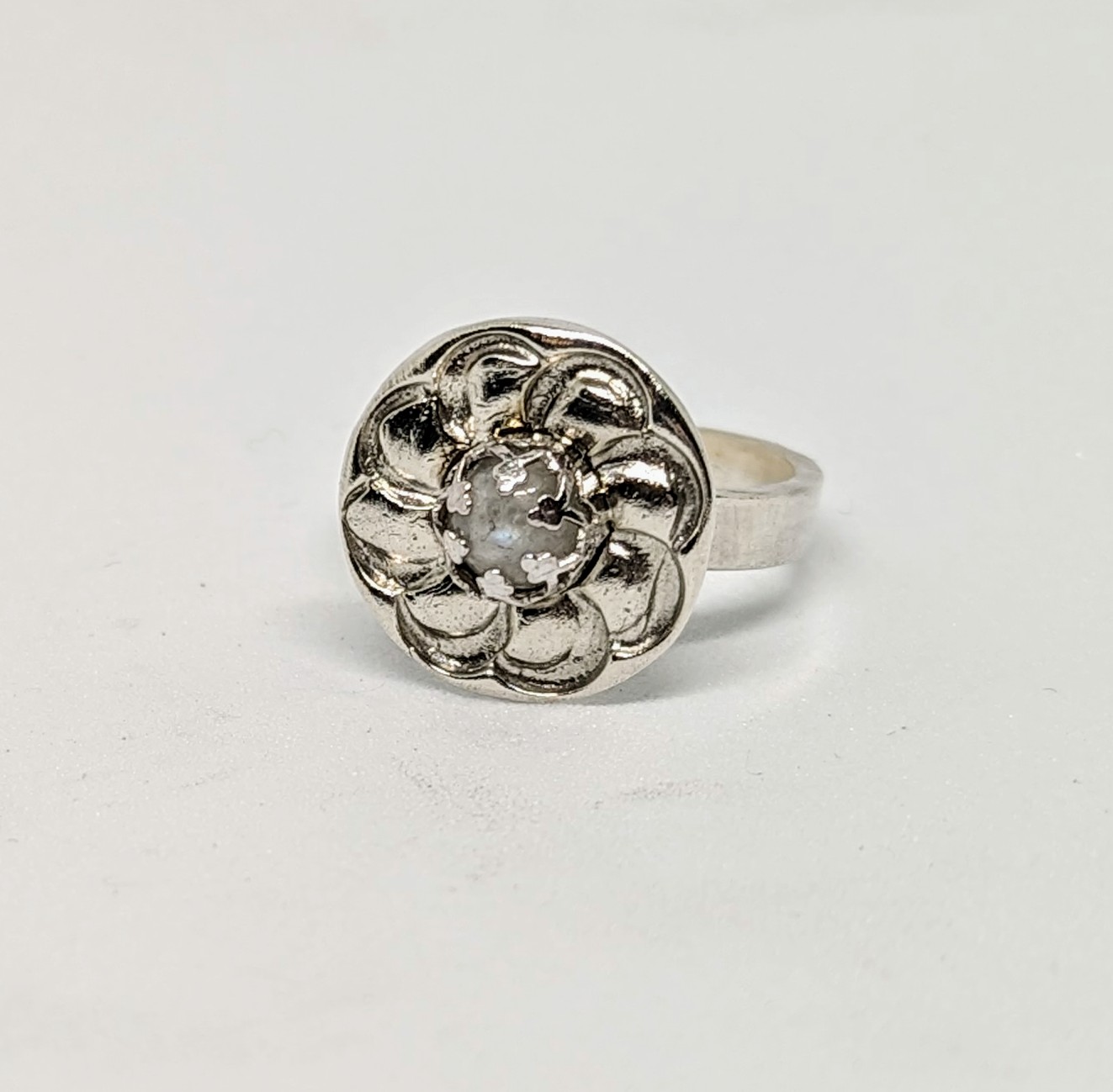 a silver ring with a stone in the middle