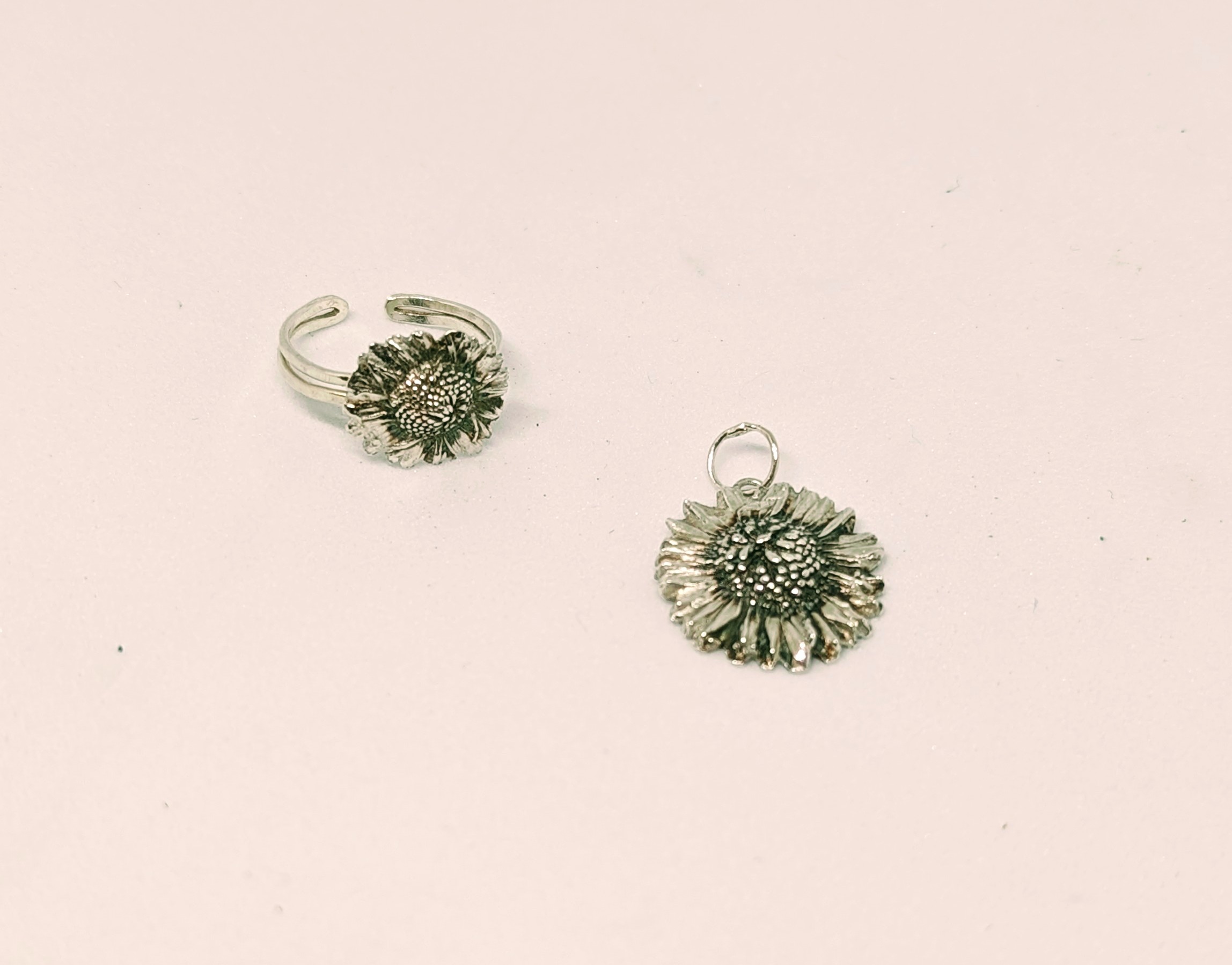 a pair of silver sunflower earrings