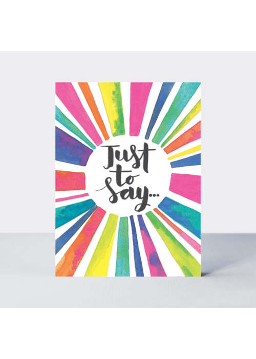 a card with rainbow colors and a circle in the middle