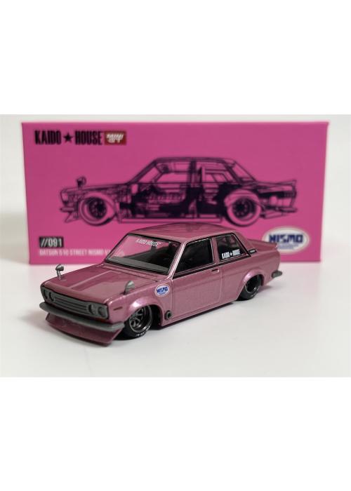 a pink toy car in front of a pink box