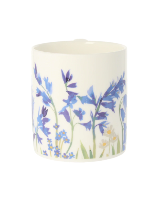 a white cup with blue flowers on it