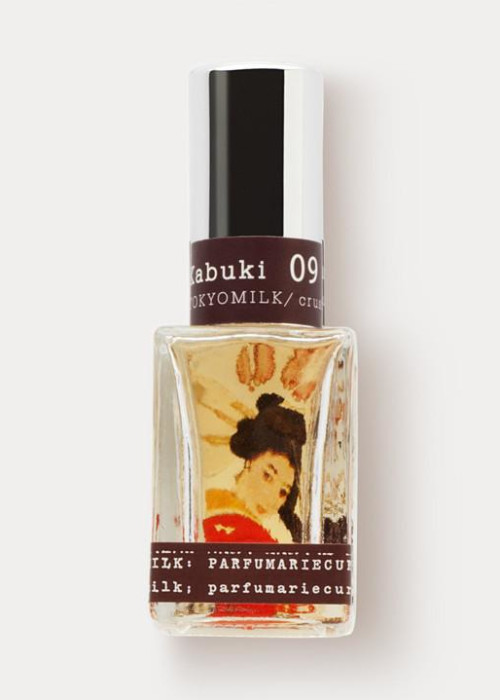 a bottle of perfume with a picture of a woman