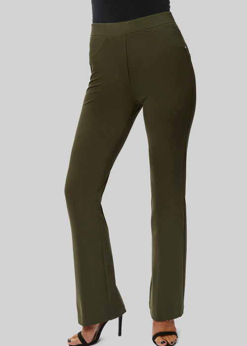 a woman wearing green pants