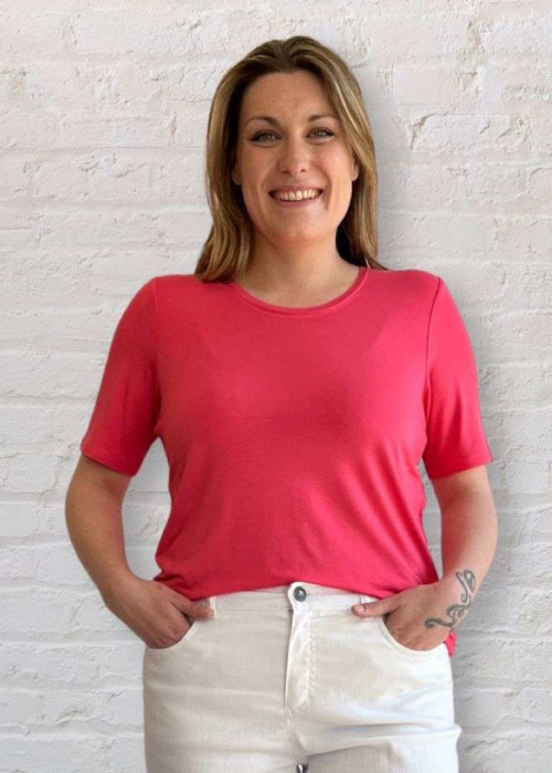 a woman in a pink shirt