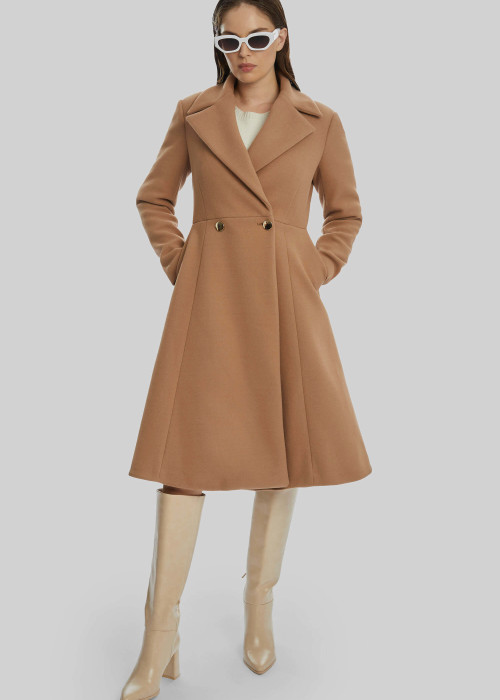 a woman in a brown coat