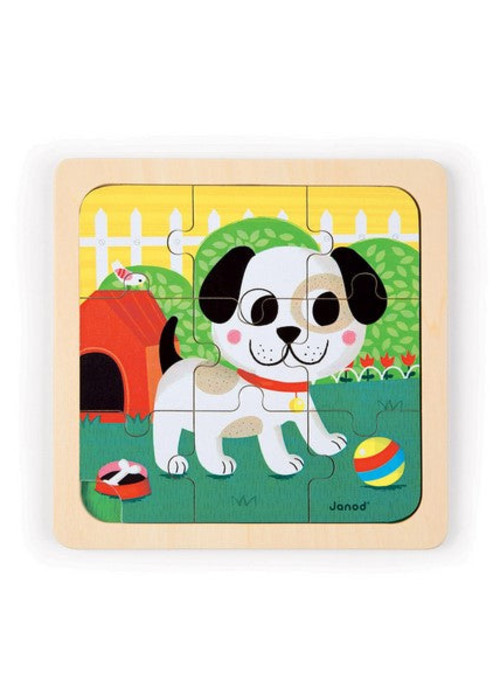 a wooden puzzle with a dog on it