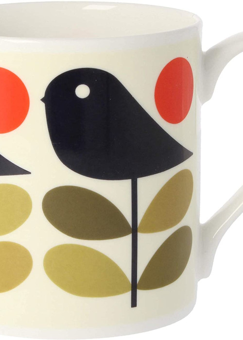 a white mug with a bird design on it