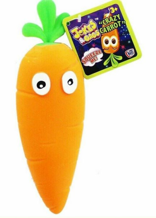 a toy carrot with eyes and a tag