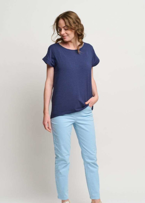 a woman in blue shirt and blue pants