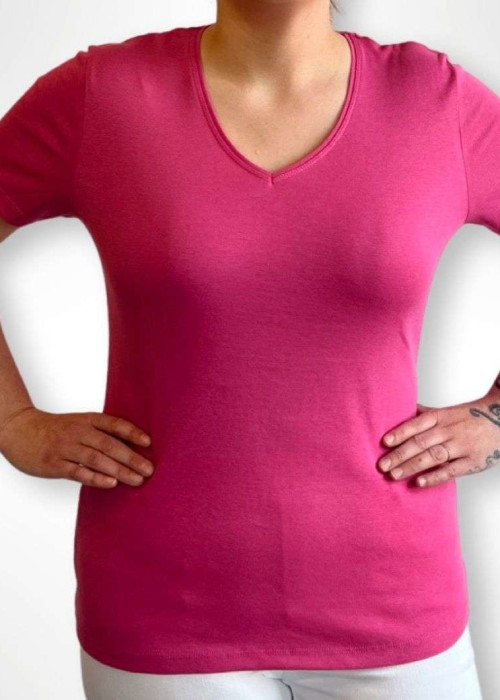 a woman wearing a pink shirt