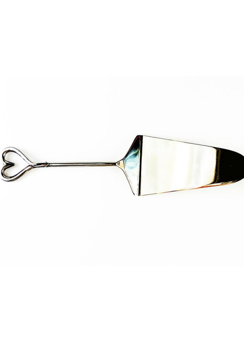 a silver cake server with a heart shaped handle