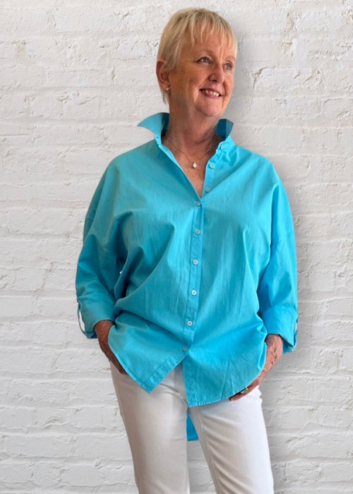 a woman in a blue shirt