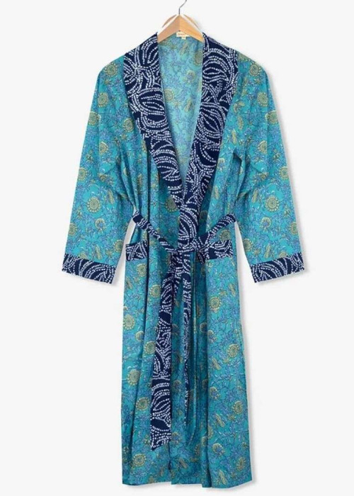 a blue robe with white paisley trim