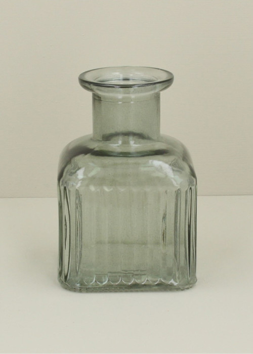 a glass vase on a table