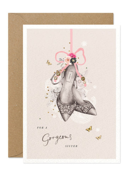 a card with a drawing of shoes and flowers